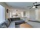 Spacious living room with a comfortable sofa, stylish rug, and an open view of the kitchen at 8407 Kettledrum St, Las Vegas, NV 89139