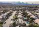 Community aerial view highlighting homes with solar panels, lush backyards, and sparkling swimming pools at 8412 Starstruck Ave, Las Vegas, NV 89143