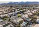 A beautiful community aerial view showcases homes with backyard pools, desert landscaping, and neighborhood streets at 8412 Starstruck Ave, Las Vegas, NV 89143
