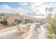 This backyard boasts a covered patio with a built-in bar, a refreshing pool, and ample seating at 8412 Starstruck Ave, Las Vegas, NV 89143
