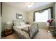 Comfortable bedroom features carpet flooring, a queen size bed and neutral paint at 8412 Starstruck Ave, Las Vegas, NV 89143