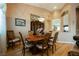 Dining area showcasing hardwood floors, dining table, and china cabinet at 8412 Starstruck Ave, Las Vegas, NV 89143