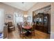 Charming dining room with a chandelier, wood table with seating for eight at 8412 Starstruck Ave, Las Vegas, NV 89143