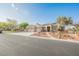 Beautiful home with a three-car garage, desert landscaping, solar panels, and a charming front entrance at 8412 Starstruck Ave, Las Vegas, NV 89143