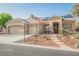 Attractive home with desert landscaping, stone accents, solar panels, and a three-car garage at 8412 Starstruck Ave, Las Vegas, NV 89143