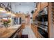 Modern kitchen featuring stainless steel appliances, granite countertops, and ample cabinet space at 8412 Starstruck Ave, Las Vegas, NV 89143