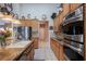 Modern kitchen featuring stainless steel appliances, granite countertops, and ample cabinet space at 8412 Starstruck Ave, Las Vegas, NV 89143