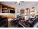 Cozy living room with built-in shelving, a TV, and comfortable seating at 8412 Starstruck Ave, Las Vegas, NV 89143