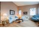 Comfortable living room with a sofa, arm chairs, and neutral color walls at 8412 Starstruck Ave, Las Vegas, NV 89143