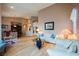 Open-concept living room offering ample seating, hardwood floors and neutral walls at 8412 Starstruck Ave, Las Vegas, NV 89143