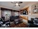 Inviting living room featuring comfortable seating, a fireplace, and built-in shelving at 8412 Starstruck Ave, Las Vegas, NV 89143