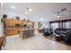 Open floor plan showcasing a combined kitchen, dining, and living area with tile flooring at 8412 Starstruck Ave, Las Vegas, NV 89143
