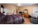 Spacious main bedroom with hardwood flooring, neutral walls, and a ceiling fan, perfect for relaxation at 8412 Starstruck Ave, Las Vegas, NV 89143