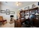 Spacious home office with a large desk, built in shelving, and natural light at 8412 Starstruck Ave, Las Vegas, NV 89143
