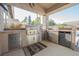 Gourmet outdoor kitchen with stainless steel appliances, built-in grill, and ample counter space for entertaining at 8412 Starstruck Ave, Las Vegas, NV 89143