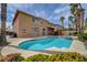 Lush backyard with pool, covered patio, and meticulous landscaping provides the perfect outdoor retreat and entertainment space at 8716 Castle Hill Ave, Las Vegas, NV 89129
