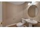 Simple bathroom featuring a pedestal sink and toilet with neutral wall color at 8716 Castle Hill Ave, Las Vegas, NV 89129