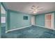 Spacious bedroom features ample natural light and a ceiling fan at 8716 Castle Hill Ave, Las Vegas, NV 89129