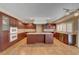 Well-lit kitchen boasts stainless steel appliances and a functional center island for meal prep at 8716 Castle Hill Ave, Las Vegas, NV 89129