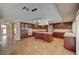 Spacious kitchen featuring a large island, custom cabinetry, and modern lighting fixtures at 8716 Castle Hill Ave, Las Vegas, NV 89129