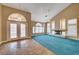 This living room has a fireplace, ample light and stylish floors at 8716 Castle Hill Ave, Las Vegas, NV 89129