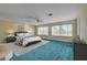 Large main bedroom with carpet flooring, generous natural light, and a ceiling fan at 8716 Castle Hill Ave, Las Vegas, NV 89129