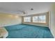 Spacious main bedroom boasting large windows for natural light, ceiling fan, and soft carpet flooring at 8716 Castle Hill Ave, Las Vegas, NV 89129