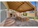 This covered patio offers outdoor dining space and a built-in grill at 8716 Castle Hill Ave, Las Vegas, NV 89129