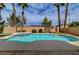 Refreshing pool with a built-in hot tub and meticulously maintained landscaping creating a tranquil backyard retreat at 8716 Castle Hill Ave, Las Vegas, NV 89129