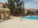 Community pool and sundeck offers a relaxing oasis surrounded by lush greenery at 900 Heavenly Hills Ct # 219, Las Vegas, NV 89145