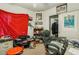 A cluttered bedroom featuring a desk, filing cabinet, and various items at 9051 Sandy Slate Way, Las Vegas, NV 89123