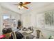 Cozy dining area with natural light, a ceiling fan, and a view of the backyard at 9051 Sandy Slate Way, Las Vegas, NV 89123