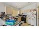 Functional kitchen with ample cabinet space, granite counters, and essential appliances at 9051 Sandy Slate Way, Las Vegas, NV 89123