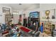 Bright living room with a fireplace, neutral walls, and a comfortable seating area at 9051 Sandy Slate Way, Las Vegas, NV 89123