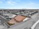 Aerial shot showcases a home with a pool, desert landscaping, and a paver driveway and backyard at 9096 Becket Ranch Ct, Las Vegas, NV 89113