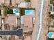 Aerial shot of a backyard with a built-in outdoor kitchen, and a pool and jacuzzi at 9096 Becket Ranch Ct, Las Vegas, NV 89113