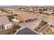 Spacious two-story home featuring a tile roof, a three-car garage, and a desert-landscaped front yard at 9096 Becket Ranch Ct, Las Vegas, NV 89113