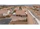 View of a home with an arched doorway, two-car garage, desert landscaping, and a large paved driveway at 9096 Becket Ranch Ct, Las Vegas, NV 89113