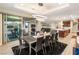 Open concept dining room leading out to patio and adjacent to kitchen at 9096 Becket Ranch Ct, Las Vegas, NV 89113