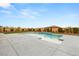 Backyard pool featuring a tiled deck with water features and green landscaping at 9096 Becket Ranch Ct, Las Vegas, NV 89113