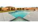 Pool area features a waterfall feature, an outdoor kitchen, and an in-pool seating area at 9096 Becket Ranch Ct, Las Vegas, NV 89113