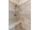 Corner of the shower displays the patterned tile, shower head, and built in seat at 9096 Becket Ranch Ct, Las Vegas, NV 89113