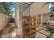 Inviting backyard featuring a greenhouse, wooden accents, and tiled flooring for a unique outdoor experience at 9926 Swimming Hole St, Las Vegas, NV 89183