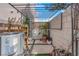 Backyard featuring a pergola, a privacy wall, and potted plants for a unique outdoor experience at 9926 Swimming Hole St, Las Vegas, NV 89183