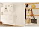 Organized entryway with storage, including shelving, coat hooks, and cubbies for shoes and bags at 9926 Swimming Hole St, Las Vegas, NV 89183