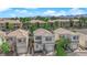Charming two-story home features a well-maintained yard, neutral color palette, and attached garage in residential neighborhood at 9926 Swimming Hole St, Las Vegas, NV 89183