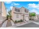 Charming two-story home with a stucco exterior, a small front yard, and an attached one car garage at 9926 Swimming Hole St, Las Vegas, NV 89183
