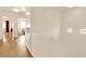 Open hallway featuring built-in cabinets, wood flooring, and elegant lighting at 9926 Swimming Hole St, Las Vegas, NV 89183