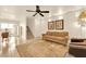 Spacious living room with sliding glass doors and staircase access at 9926 Swimming Hole St, Las Vegas, NV 89183