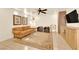 Comfortable living room featuring stylish decor, a brick fireplace, and tile flooring at 9926 Swimming Hole St, Las Vegas, NV 89183
